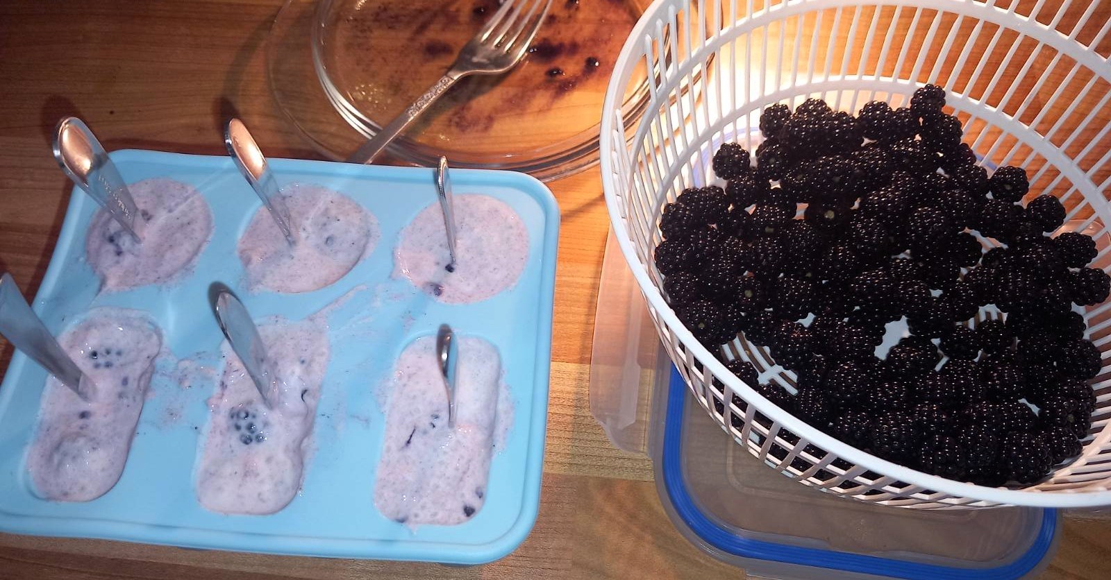Filled mould with a teaspoon standing in each lolly as a handle